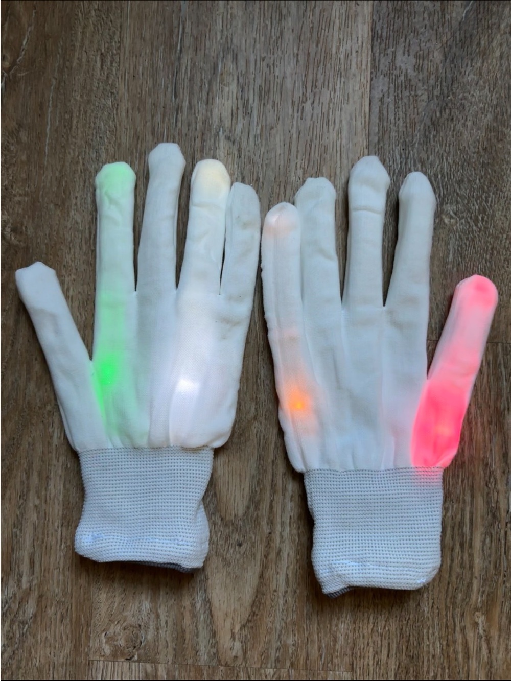 white knit LED light-up gloves featuring colorful flashing lights